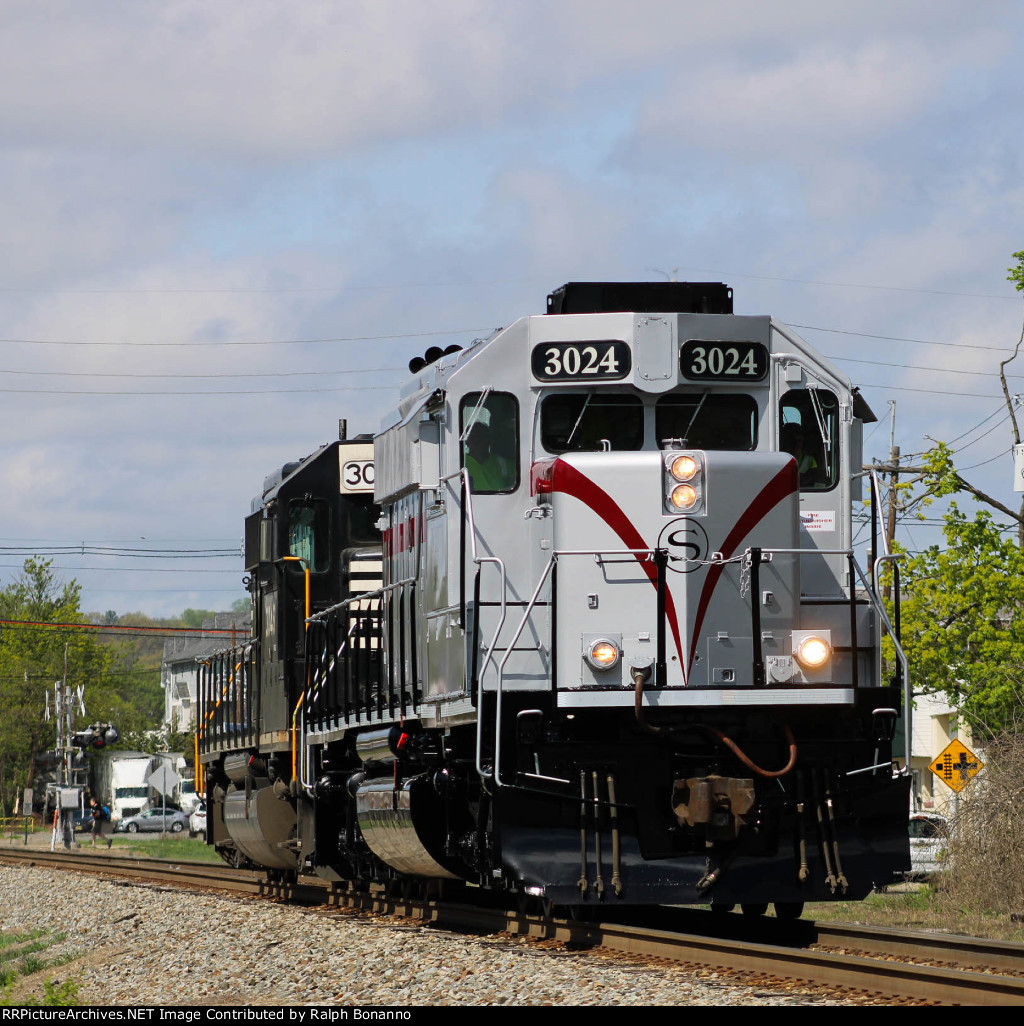 WS 1 light power eastbound thru town with freshly painted Heritage Unit 3024